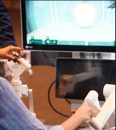 Person using robotic surgical simulator